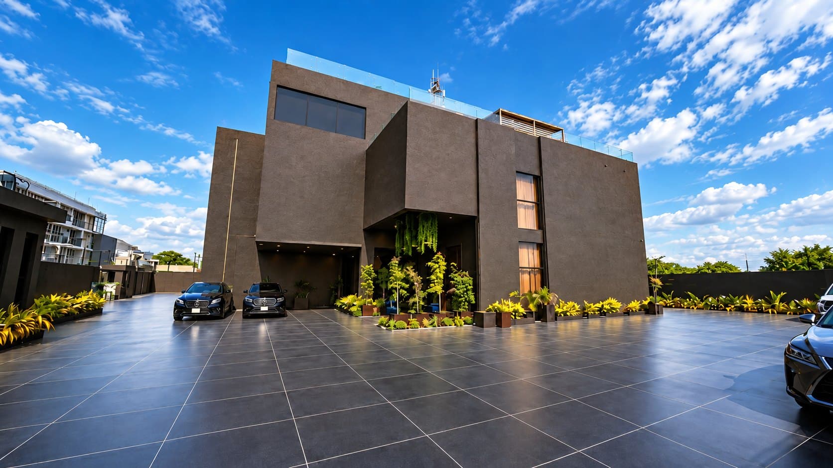 The HOC building in Lagos: a dark stone facade under a clear sky