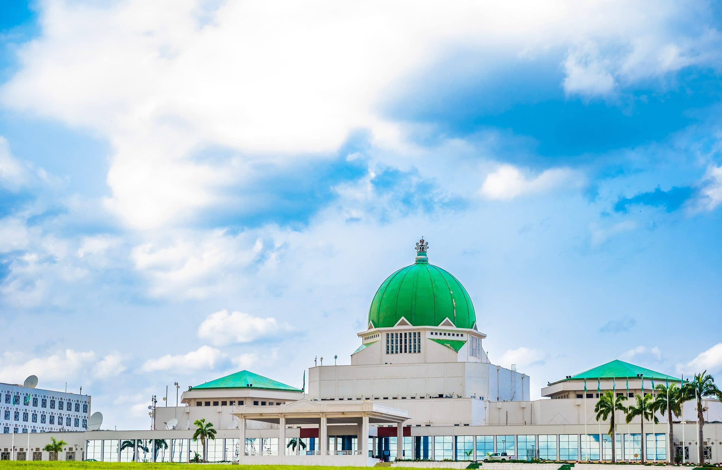 The green dome of Nigeria's National Assembly in Abuja under an open sky